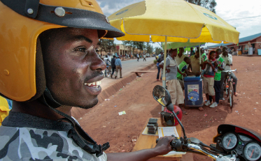Zacharie distributing MTN products with his motorbike in Rwanda