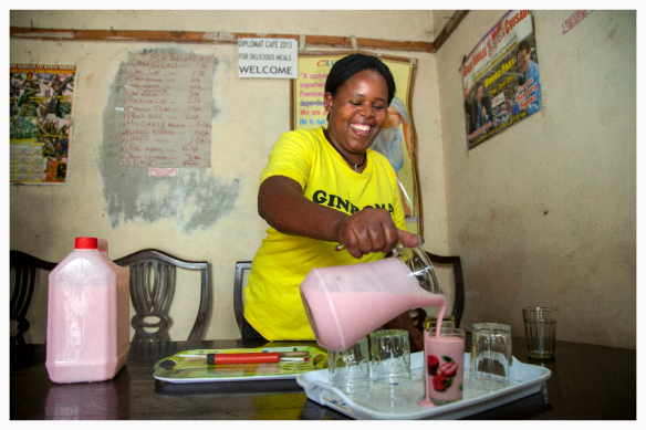 Beatrice Wanjiku, a yogurt maker from Nairobi, Kenya, pouring her yogurt into glasses