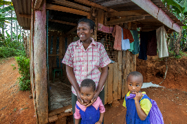 Hannah Haciku, a tailor in Nairobi, Kenya with two children 
