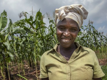 Gloria Kabagwira in front of her crops.