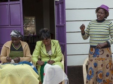 Vicky Mwema, Chairlady of The Sisters of Faith Group In Machakos, Kenya, speaking to a group of members.