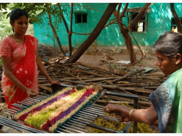Bhanumati and a co worker making mats. 