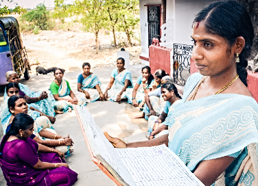 Group leader Padmavathi reading out minutes to her fellow members | Self-Help Group | Kanchipuram, India